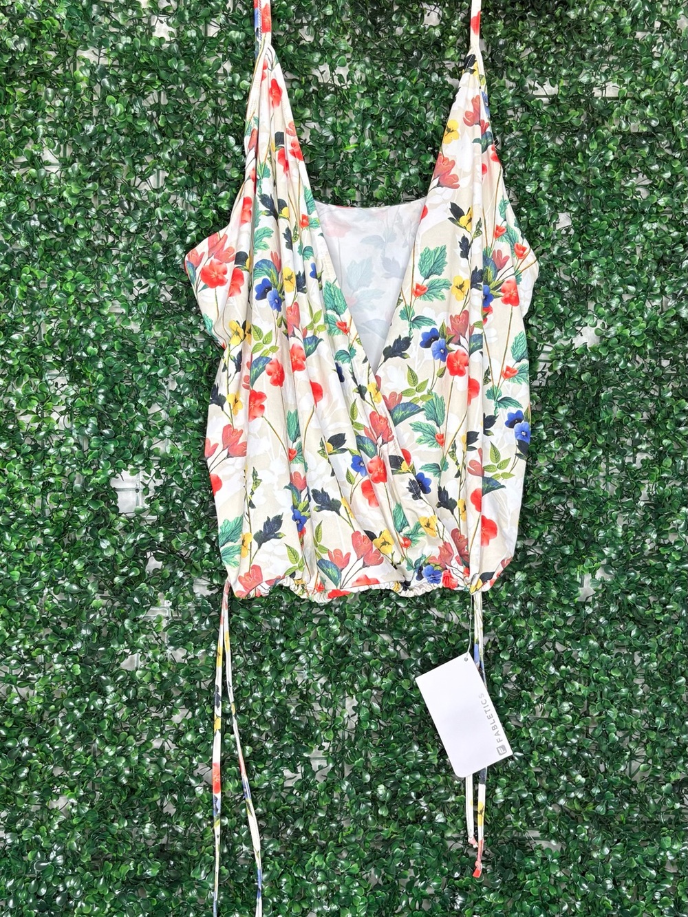 Fabletics Elaine PerformamceTank, with floral pattern and wrap style design.